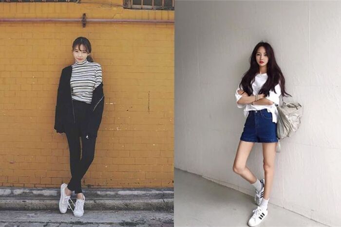 Tựa lưng vào tường, khoanh tay nhẹ nhàng